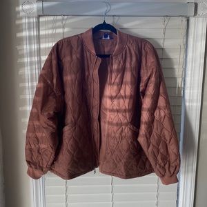 Mauve colored bomber jacket.